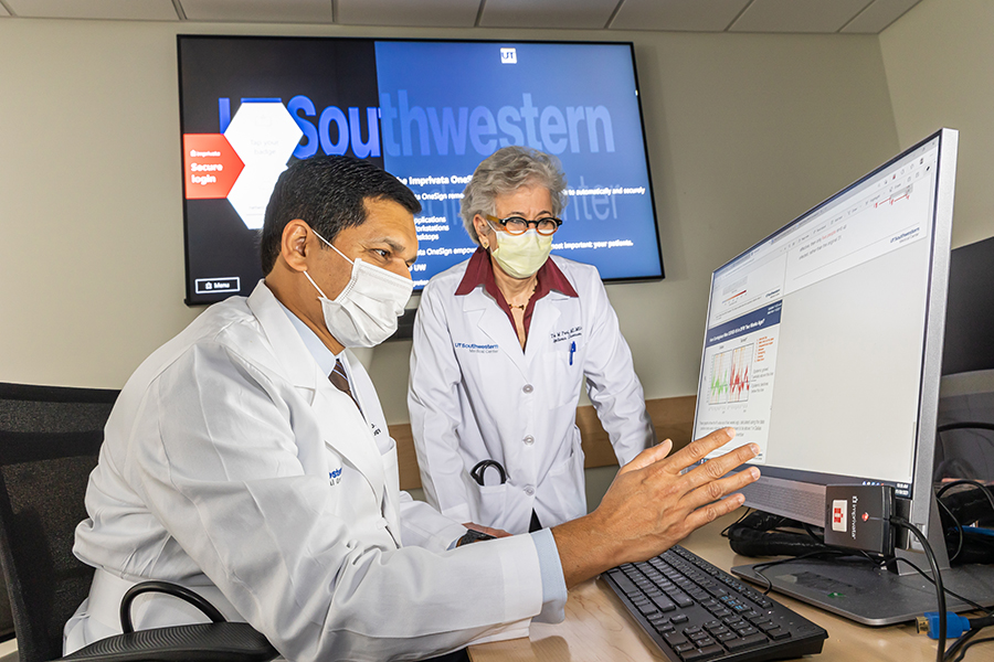 HIV Medicine Fellowship Research and Quality Improvement, a male and female doctor reviewing data on a computer screen