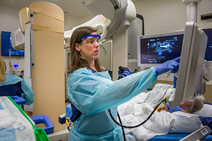 woman physician performing endoscopy