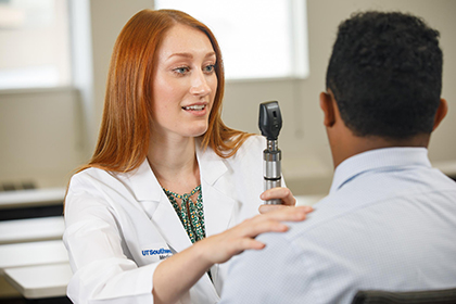 physician performing annual checkup