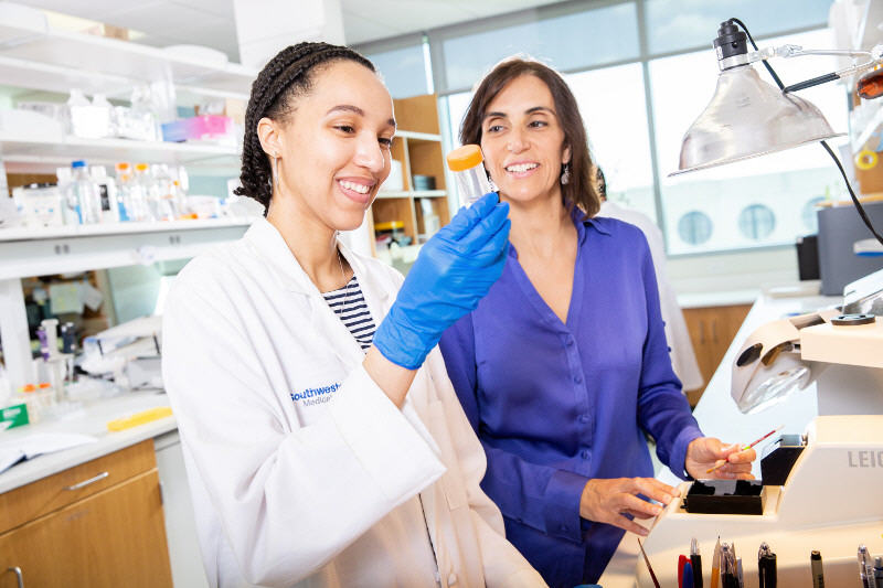 Dr. Marciano with a student in a laboratory setting