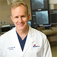 a close-up man with a white lab coat