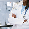 a torso of a woman doctor in a white coat