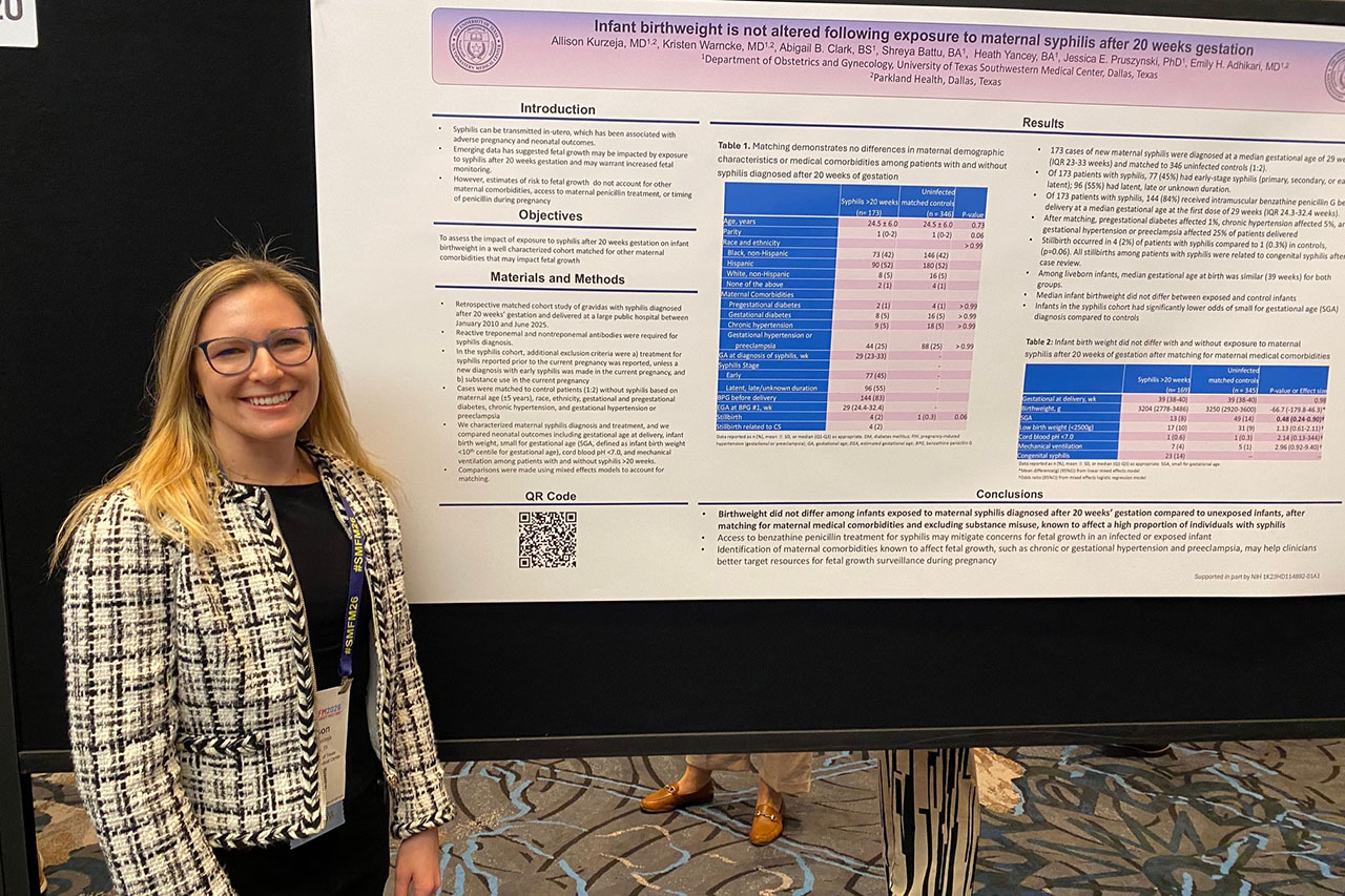 Dr. Allison Kurzeja in front of a conference poster