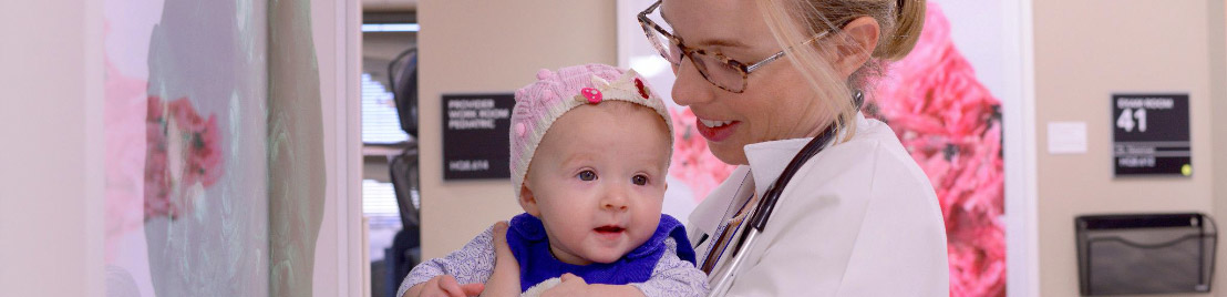 Doctor holding baby