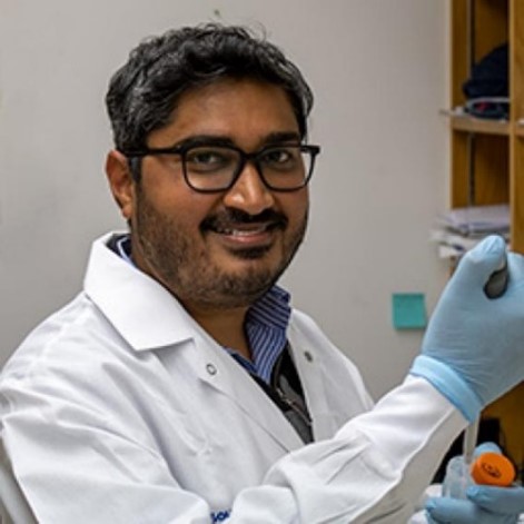 Dr. Verma working in lab