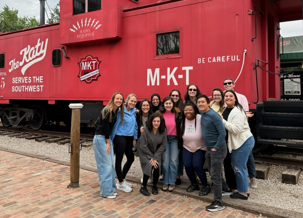 fellows in front of a train