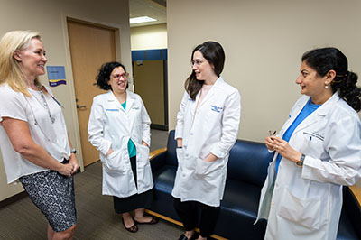 Dr. Moreland, Dr. Baltagi, Dr. Soulages and Dr. Dhar discussion in office