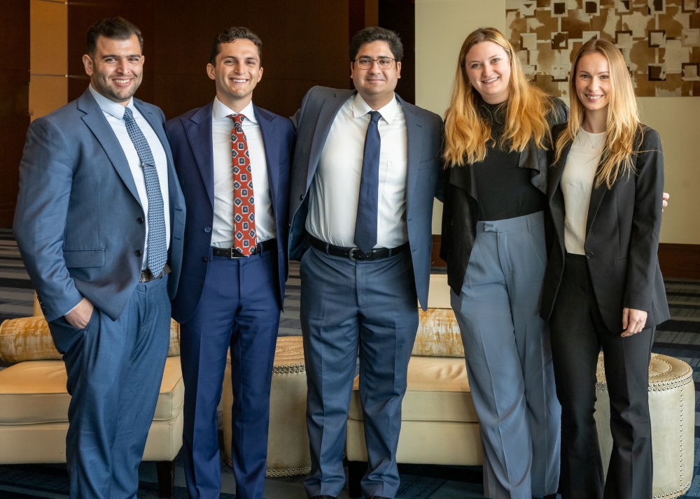standing side by side in front of office seating area, From left: Drs. Idean Roohani, Cyrus Steppe, Amin Izadpanah, Anca Dogaroiu, and Anne Bennett