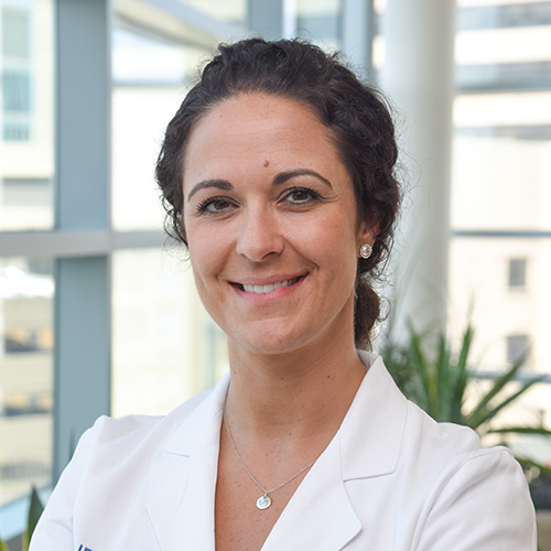 Dr. Raspovic, a smiling woman with dark hair