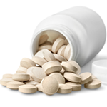 A white pill bottle with spilled white pills