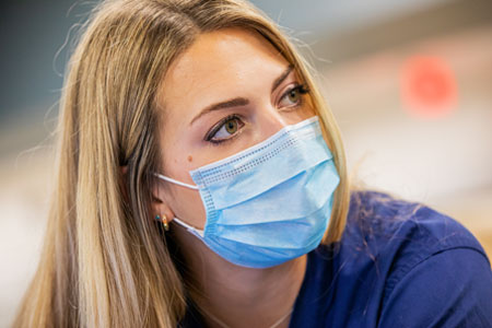 A nurse wearing a face mask