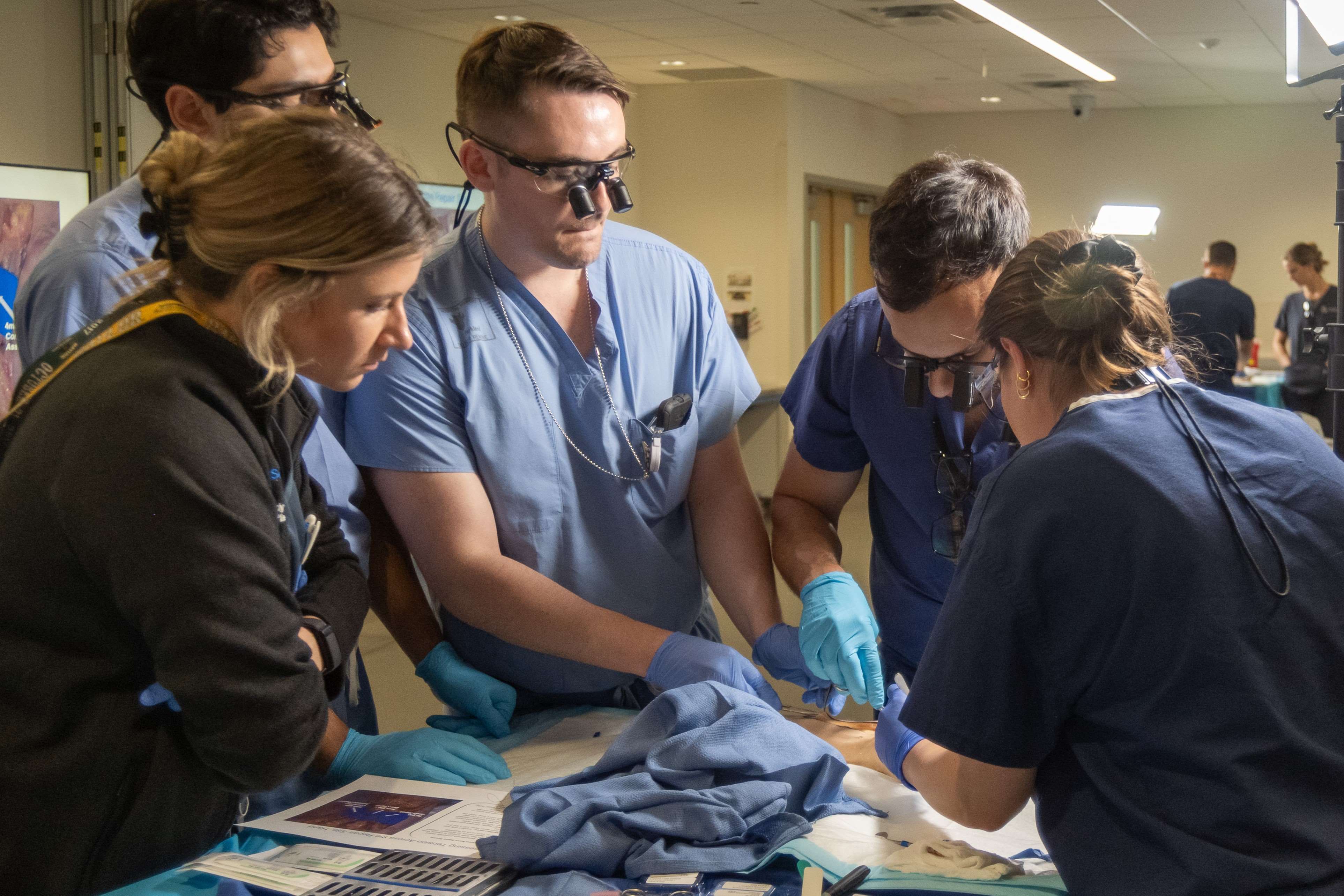 Two people do an ultrasound on a patient