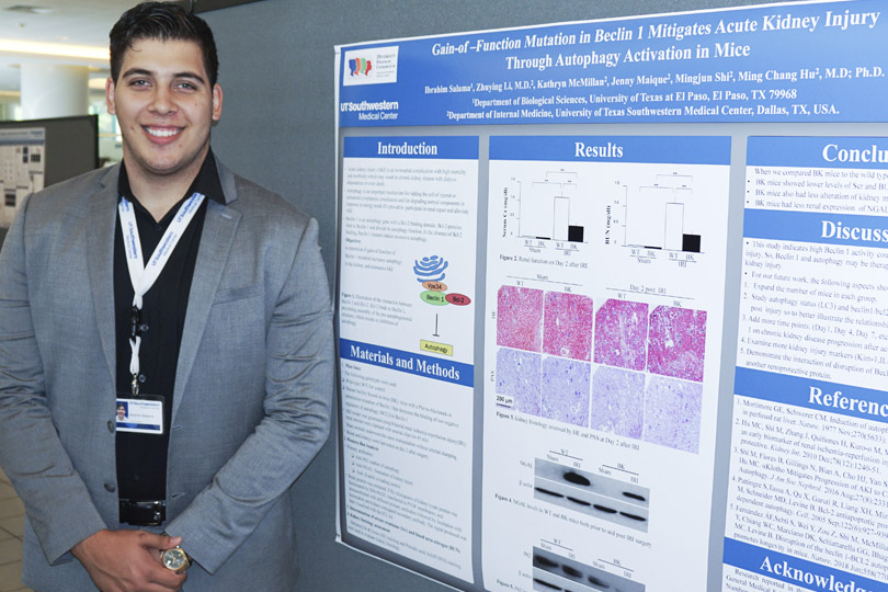 A SURISKD student stands with poster about kidney injury. A student stands with his poster that is titled Gain-of-Function Mutation in Berlin 1 Mitigates Acute Kidney Injury Through Autophagy Activation in Mice