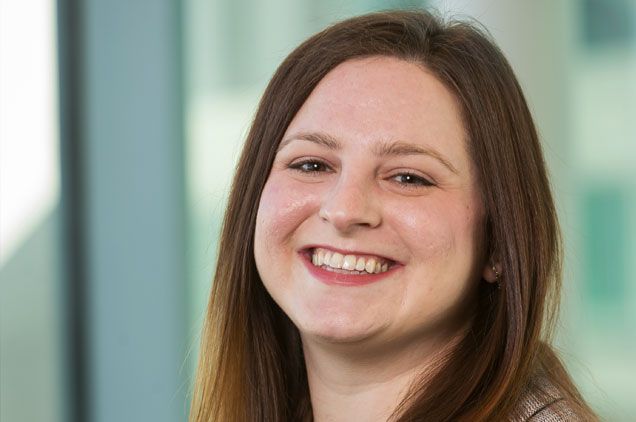 woman with brown hair, smiling