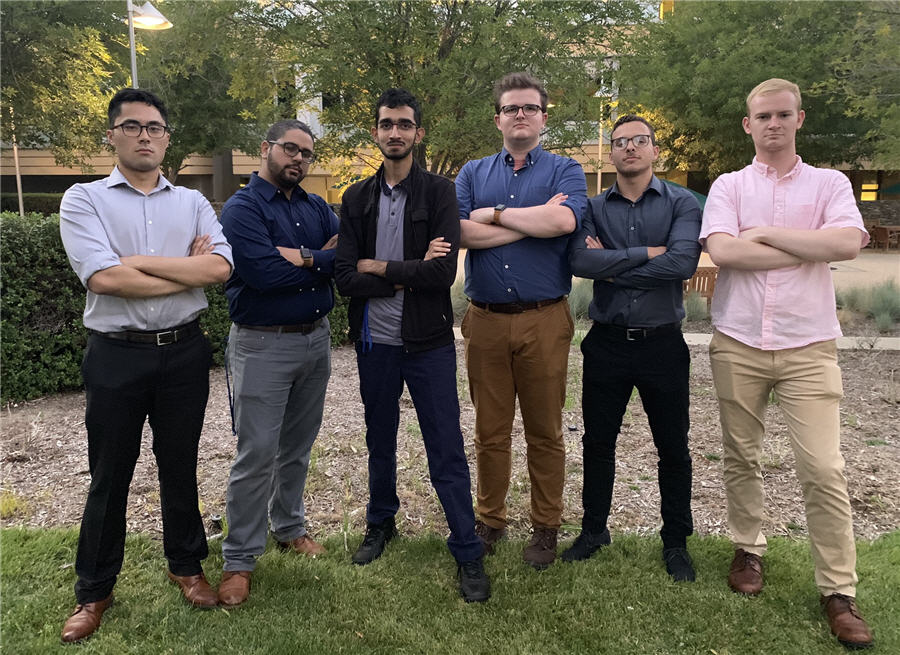 Six men standing in a row