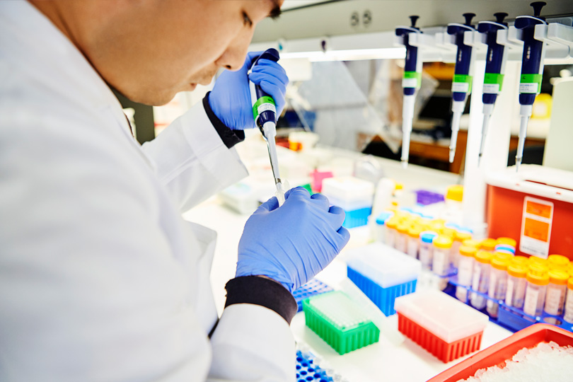 A student works in a research lab. Student working in a research lab