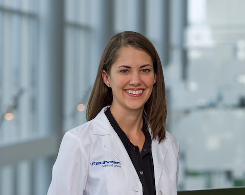 Woman in white lab coat