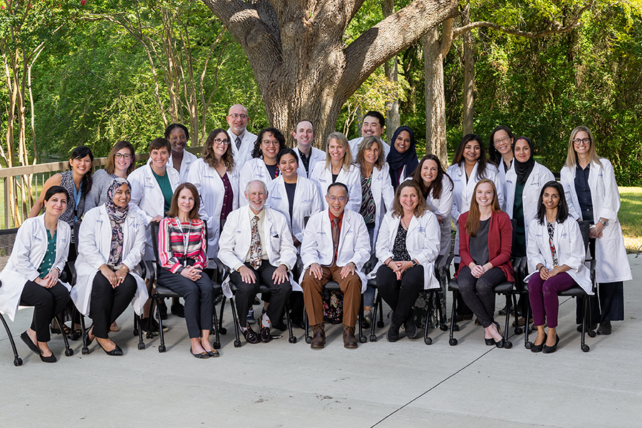 Group of faculty in white coats