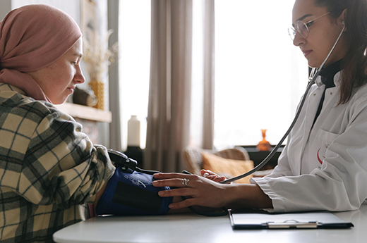 Student examining patient