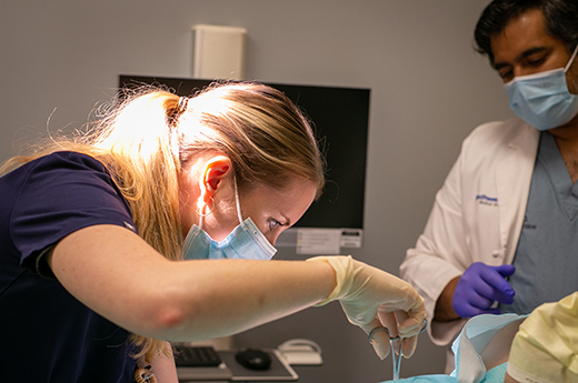 resident and faculty perform biopsy