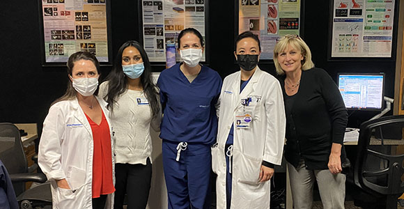 Cardiology women in Echo room with masks