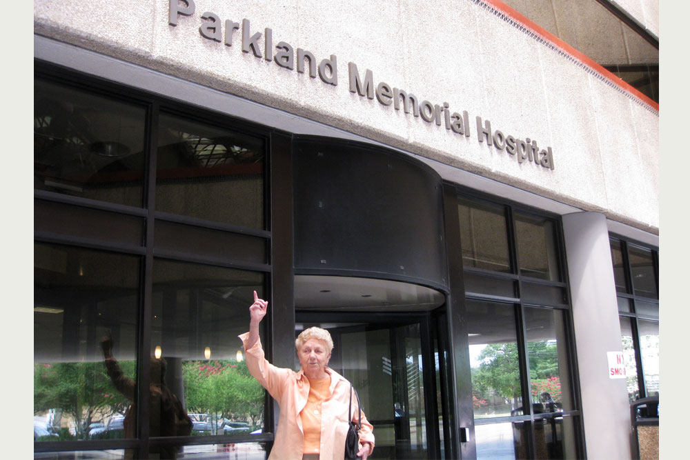 Dr. Peggy Whalley points up outside Parkland Memorial Hospital