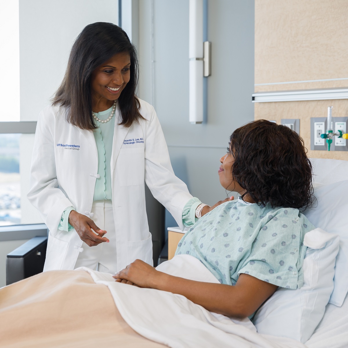 Dr. Lea with a patient at CUH