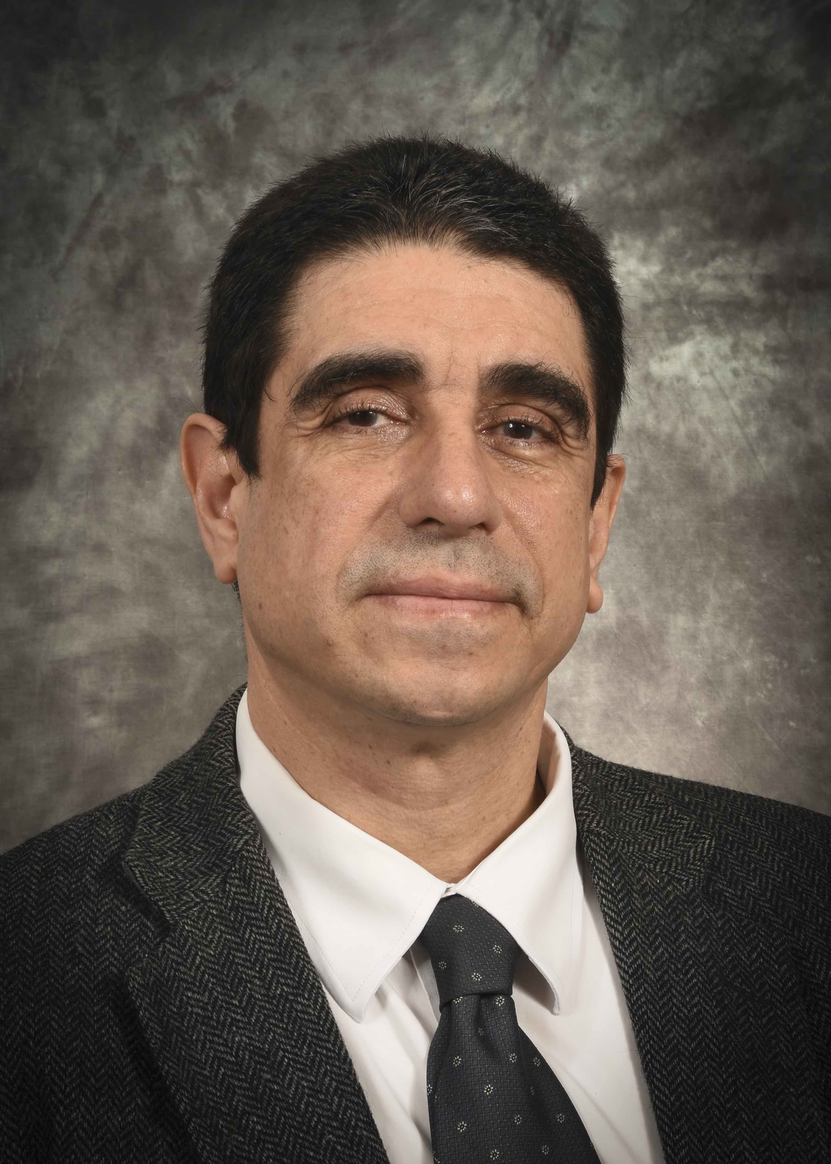 Dr. Luis E. De Las Casas, M.D.