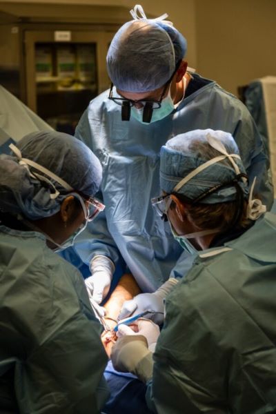 surgeon Dr. Daniel Koehler performs operation on hand