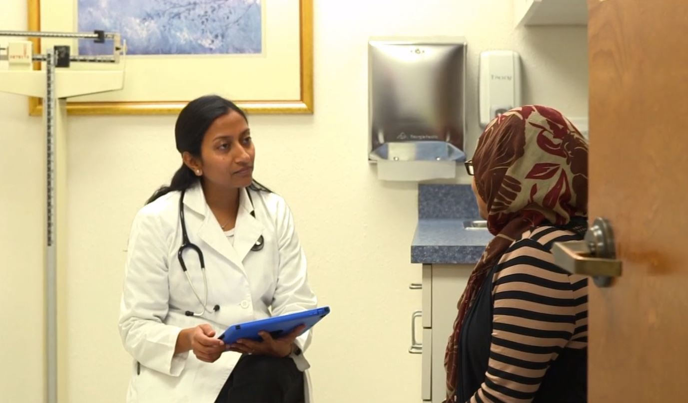 Physician discussing with patient