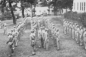 Soldiers in line with inspectors walking among them