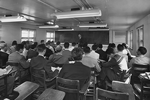 George Caldwell Lectures Students Students seen from behind with Dr. Caldwell in front
