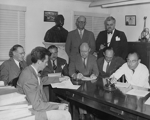 Council members sitting around a table