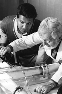 Peter Antich and a Student Two men adjusting equipment