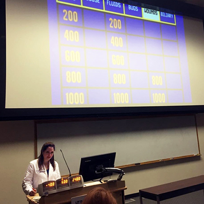 Deborah Farr, M.D., quizzes the surgery residents to prepare them for their upcoming test.
