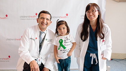 Dev Desai, M.D., and Christine Hwang, M.D., with pediatric transplant patient Dev Desai, M.D., and Christine Hwang, M.D., with pediatric transplant patient
