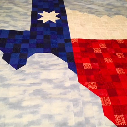 A quilt with the state of Texas on it, made by Sheryl Moss