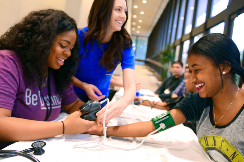 HPREP student takes another girl's blood pressure