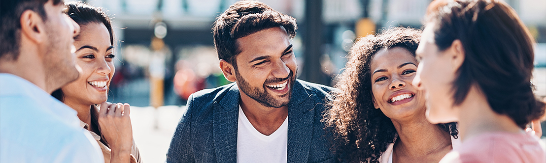 smiling diverse friends greeting each other