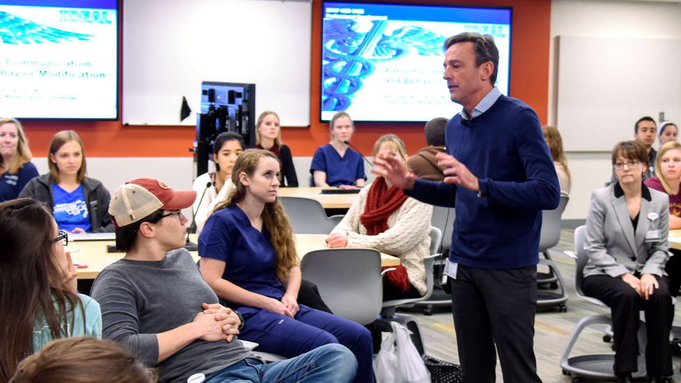 Faculty interacting with students in an informal setting