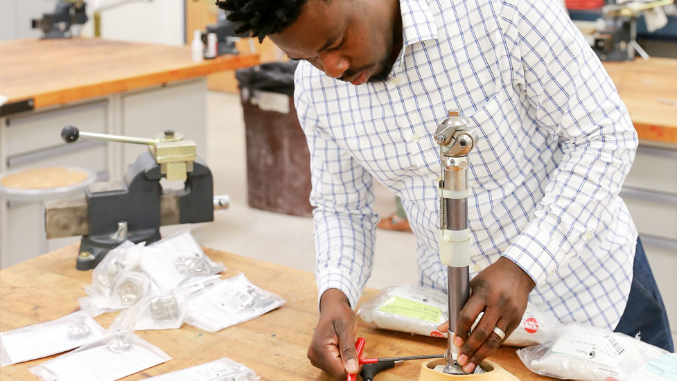 Person working with a prosthetic in the lab