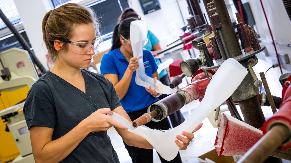 Students working in a prosthetics shop