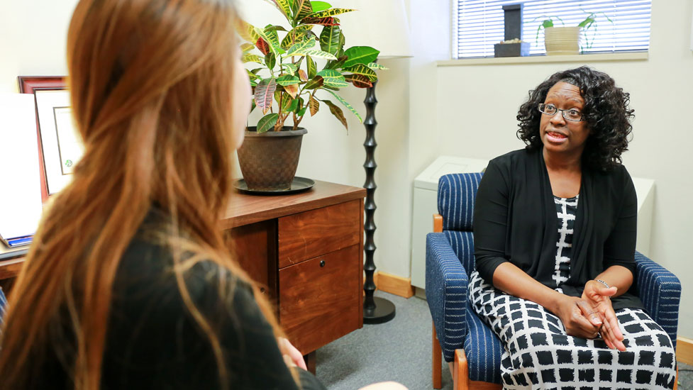 Two people talking in an office