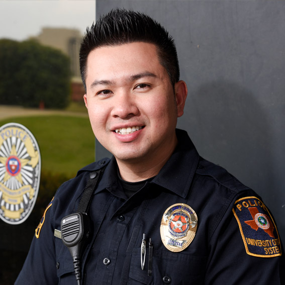 Smiling campus police officer