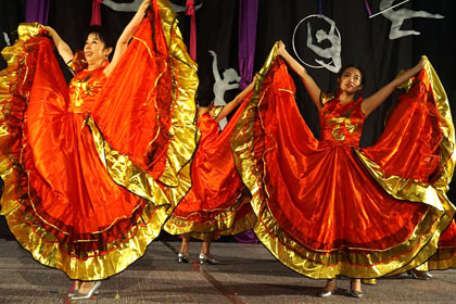 Students perform a folk dance.