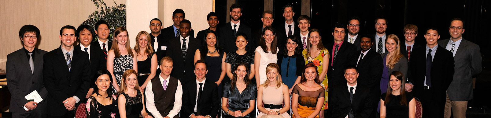 Large group of students dressed in formal attire