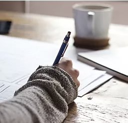 Close up of hand writing letter