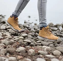 feet walking on stones