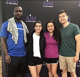 Group of four young people smiling