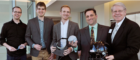 Rob Rennaker, Ph.D., (second from the right), Professor in the School of Behavioral and Brain Sciences, University of Texas at Dallas, and his research team with David Daniel, Ph.D., (first on the right) President of the University of Texas at Dallas. Dr. Rennaker has developed new technologies, such as an accelerometer and an eye movement/pupil dilation tracker device, which have the potential to be used on the field as a diagnostic tool. The TIBIR Clinical Research team will be testing Dr. Rennaker’s devices to determine if they adequately help to diagnose concussions.